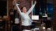 Cheerful employee exulting from joy, feeling excited after learning of upcoming promotion