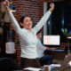 Cheerful employee exulting from joy, feeling excited after learning of upcoming promotion